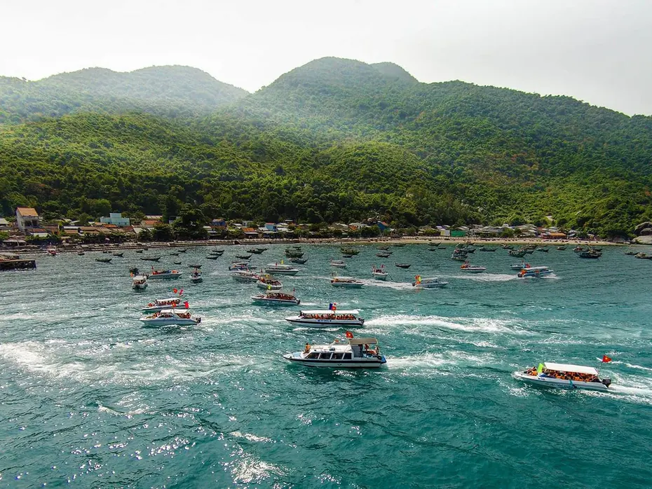 Aerial view of Cù Lao Chàm bay with the boat fleet and the village at the foot of the hill